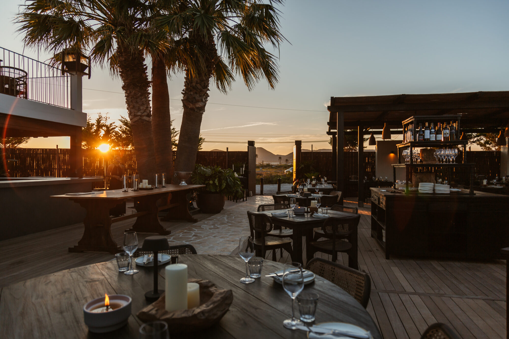Feature image The Main Ibiza with a beautiful sunset